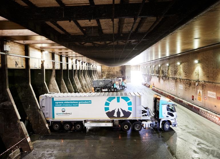 Truck reversing on the tipping apron